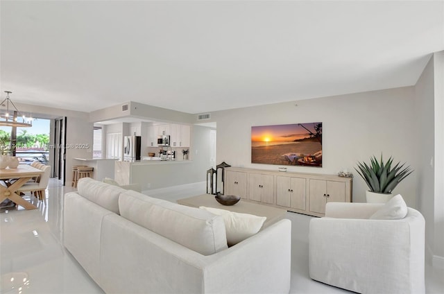 living room featuring an inviting chandelier