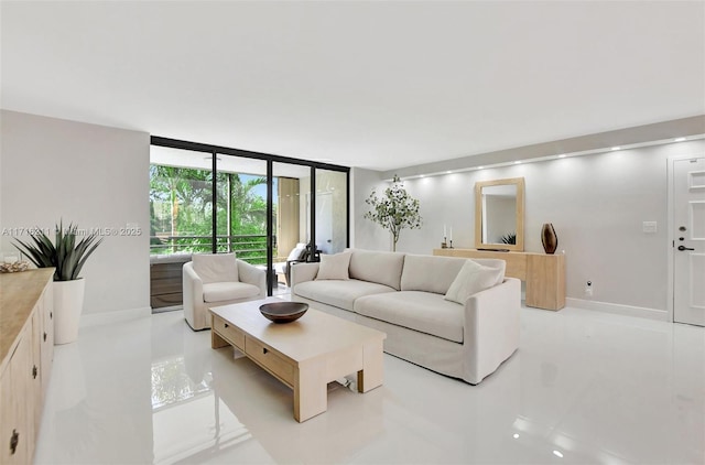 tiled living room featuring floor to ceiling windows