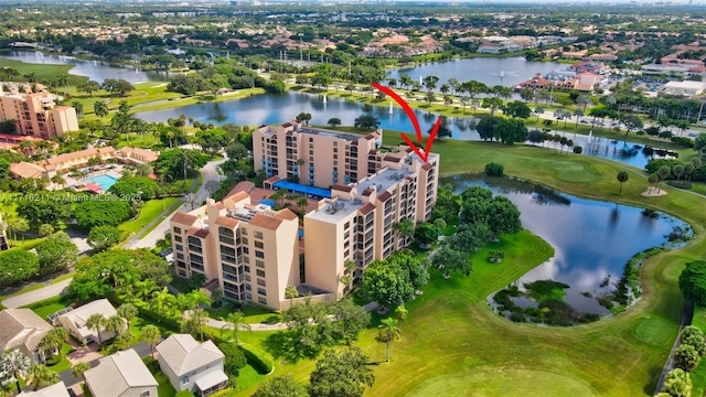 birds eye view of property with a water view