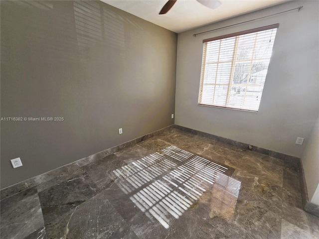 unfurnished room featuring ceiling fan