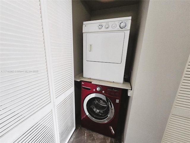 laundry room with stacked washer and clothes dryer