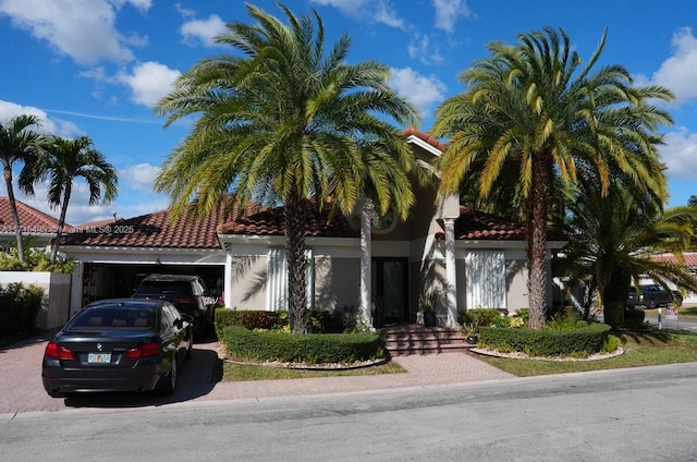 mediterranean / spanish-style home featuring a garage