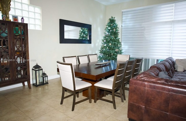 dining area with light tile patterned floors