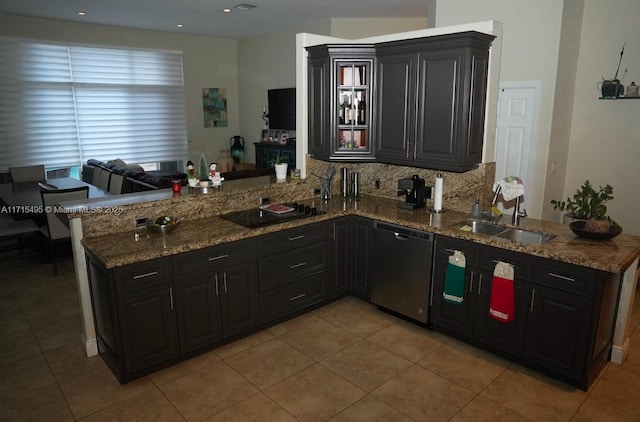 kitchen featuring kitchen peninsula, sink, light tile patterned floors, stone countertops, and dishwasher