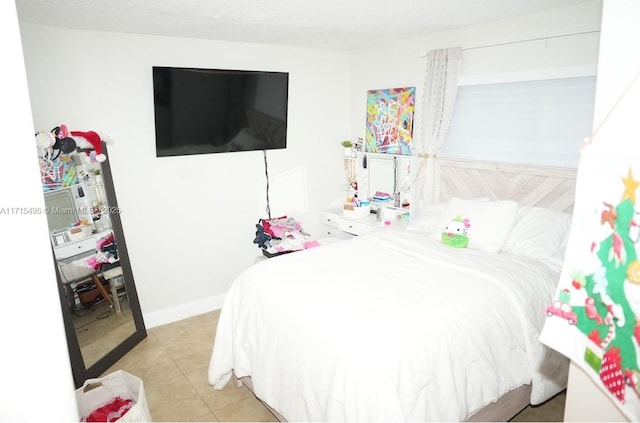 bedroom with light tile patterned flooring