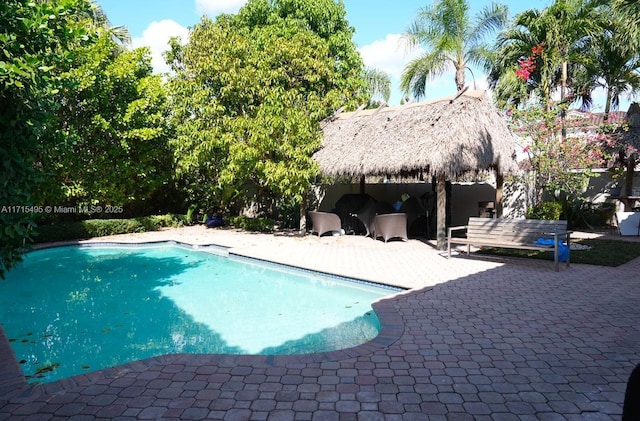 view of pool featuring a gazebo and a patio