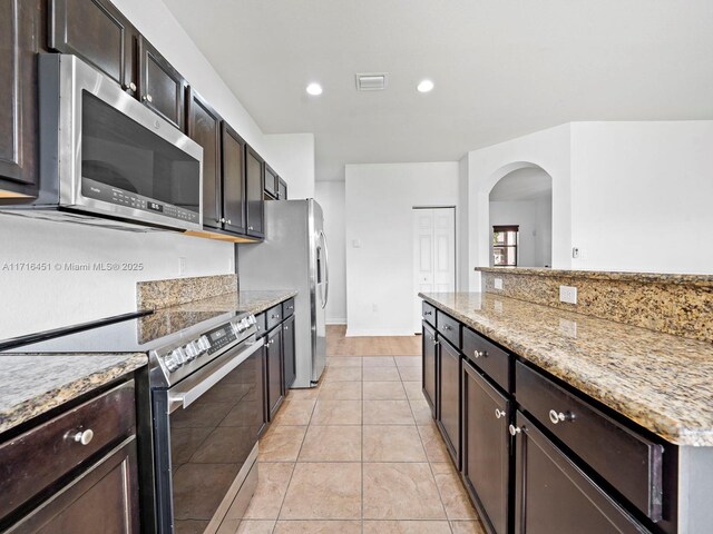 hall featuring light carpet, baseboards, visible vents, an upstairs landing, and recessed lighting