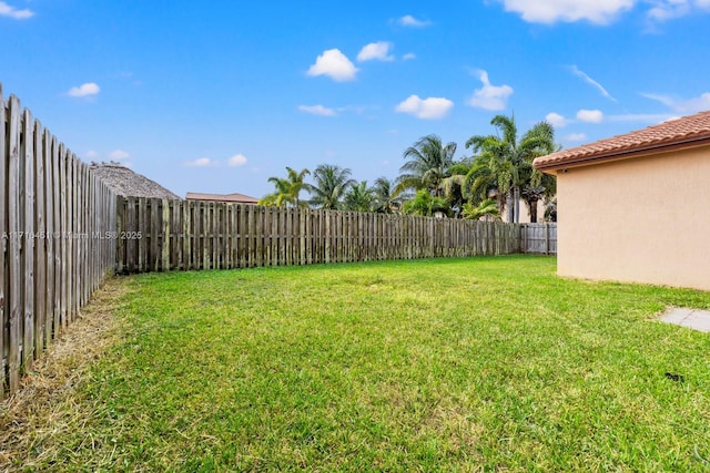 view of yard with a fenced backyard