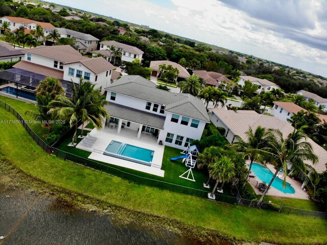 birds eye view of property with a water view