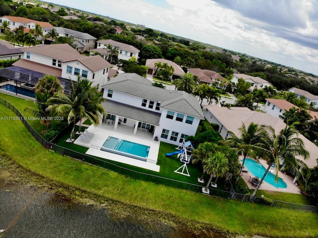 birds eye view of property with a water view