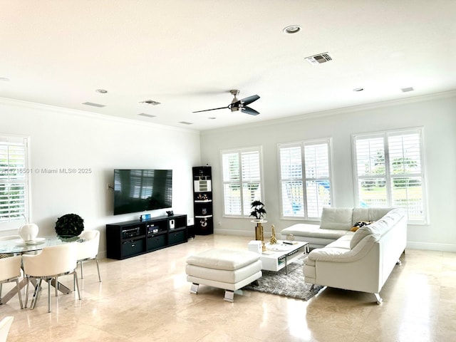 living room with ceiling fan and crown molding