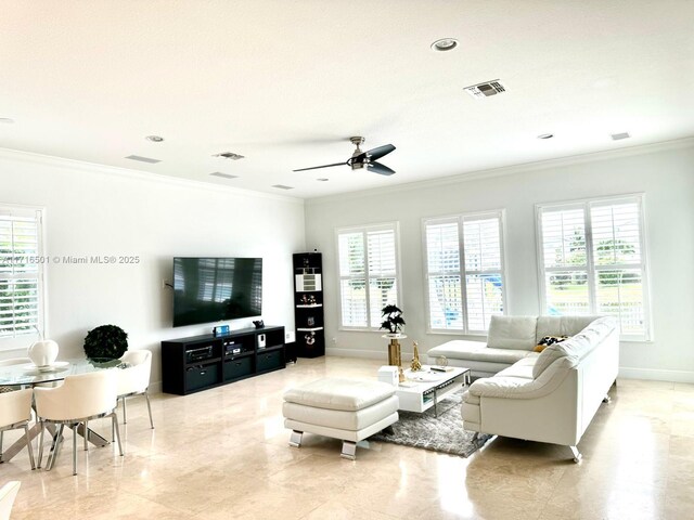 living room featuring ceiling fan and ornamental molding