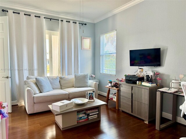 living room featuring dark hardwood / wood-style flooring and crown molding