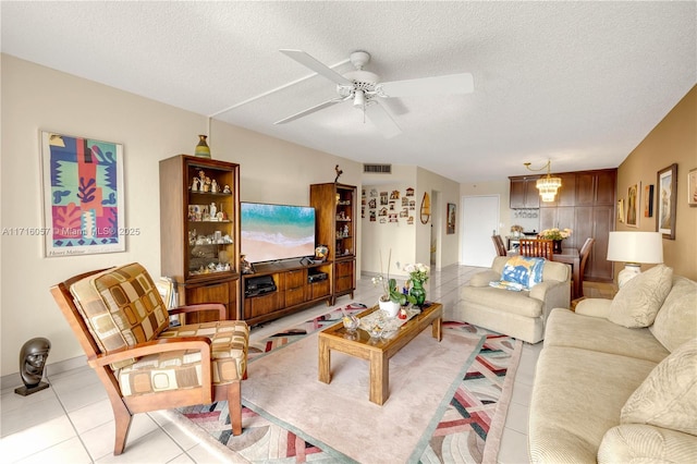 18151 NE 31st Ct Unit 1709, Aventura, FL 33160 - living area with ceiling fan, light tile patterned flooring, and a textured ceiling