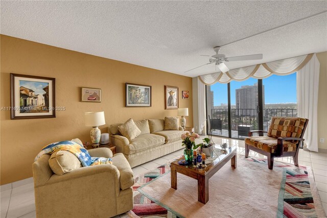 18151 NE 31st Ct Unit 1709, Aventura, FL 33160 - living room featuring a wall of windows, a textured ceiling, ceiling fan, and light tile patterned floors