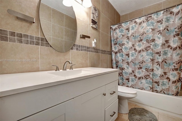 full bathroom with tasteful backsplash, tile walls, toilet, vanity, and shower / tub combo