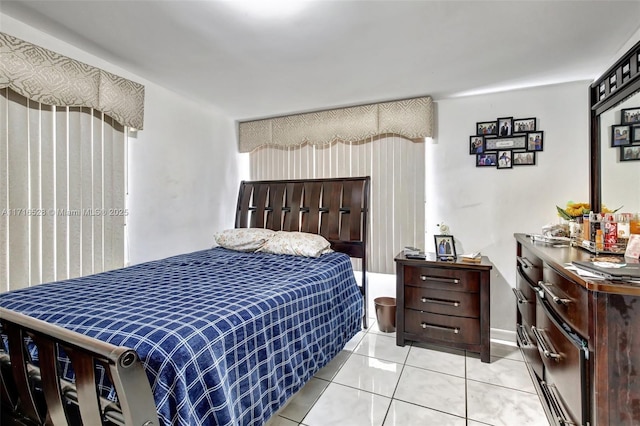 bedroom with light tile patterned floors