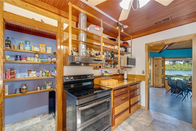 kitchen featuring ceiling fan, range hood, wood ceiling, and stainless steel range with electric stovetop