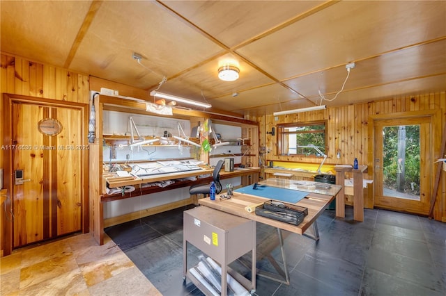 interior space with a wealth of natural light and wood walls