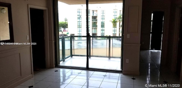 doorway to outside featuring light tile patterned floors