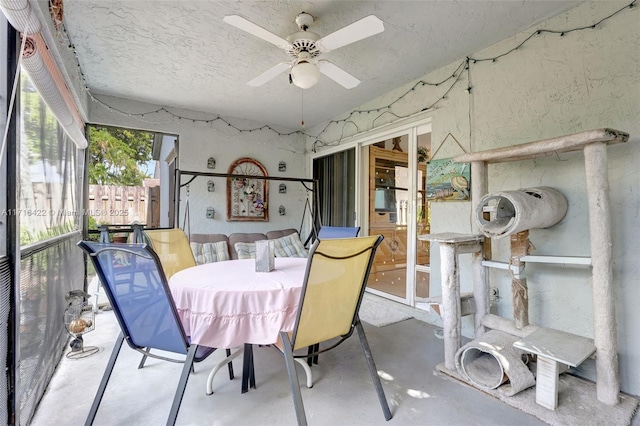 sunroom / solarium with ceiling fan