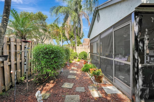 view of yard with a sunroom