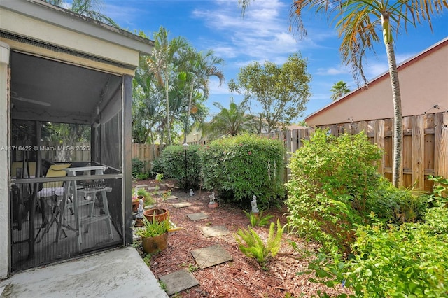 view of yard featuring a sunroom