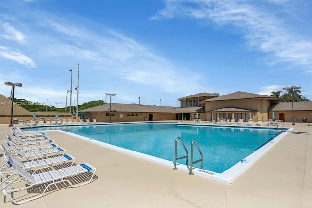 view of swimming pool with a patio area