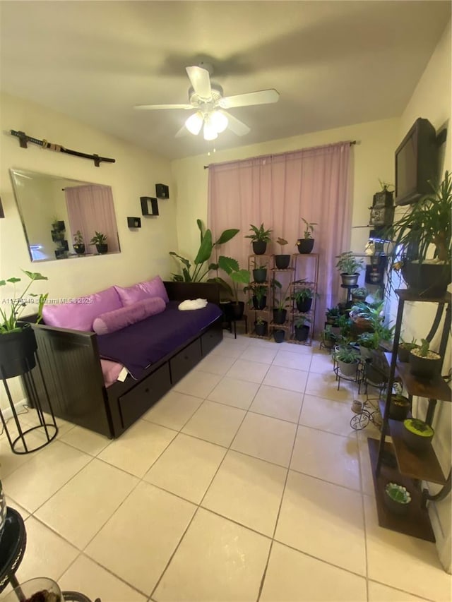 living room featuring light tile patterned floors and ceiling fan