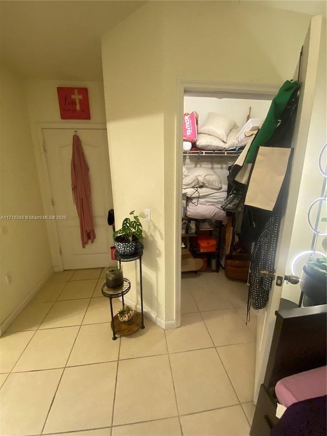 hallway with light tile patterned floors