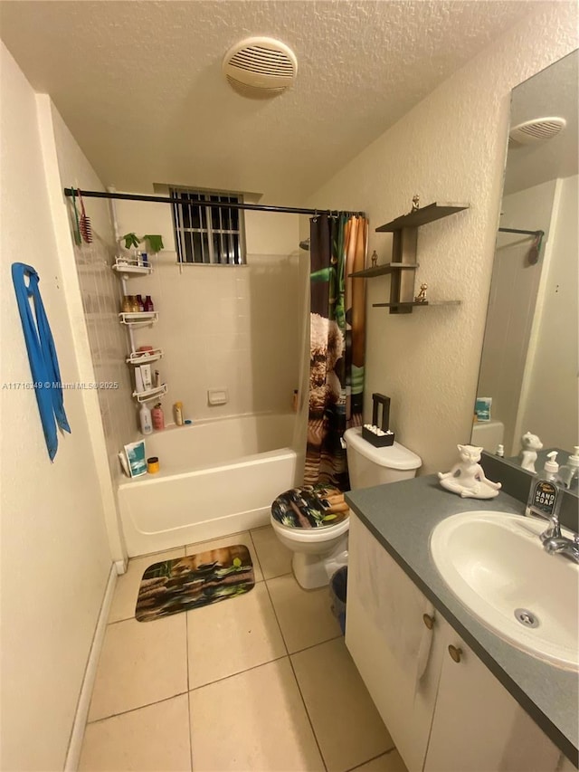 full bathroom with tile patterned flooring, shower / bath combination with curtain, a textured ceiling, toilet, and vanity