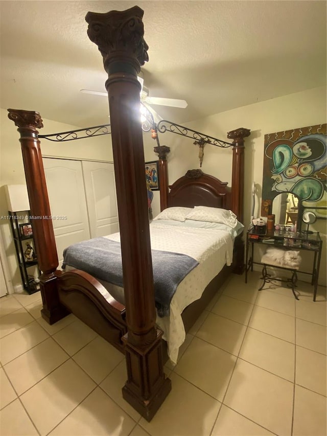 bedroom with ceiling fan and light tile patterned floors