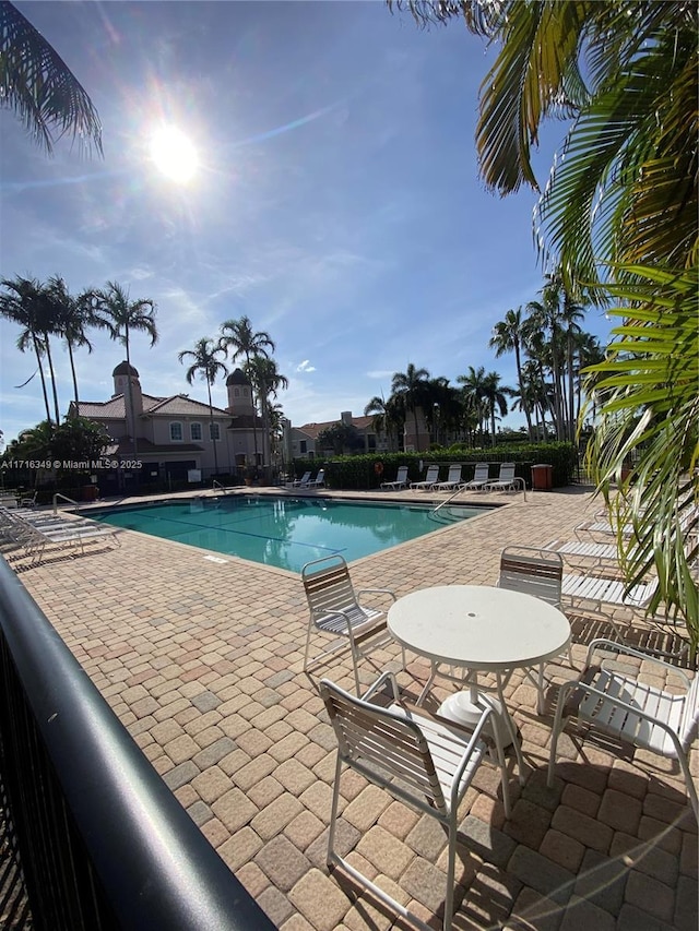 view of swimming pool with a patio