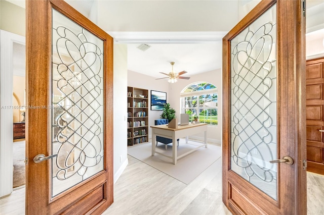 entryway with french doors, light wood-type flooring, and ceiling fan