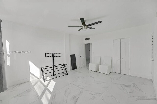 bedroom featuring a closet and ceiling fan