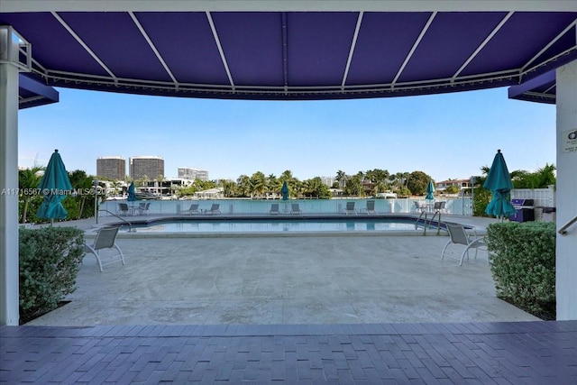 view of patio featuring a community pool