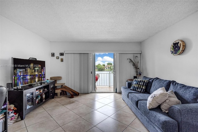 tiled living area featuring a textured ceiling