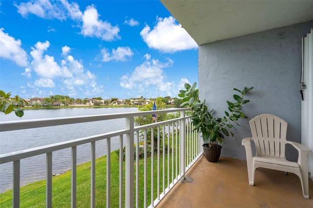 balcony featuring a water view