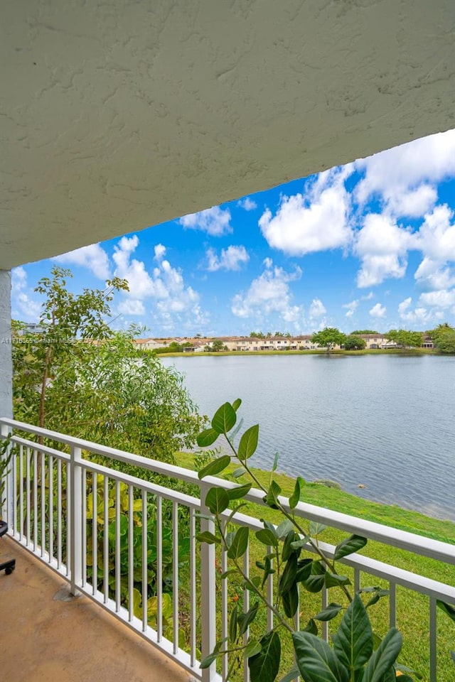 balcony featuring a water view