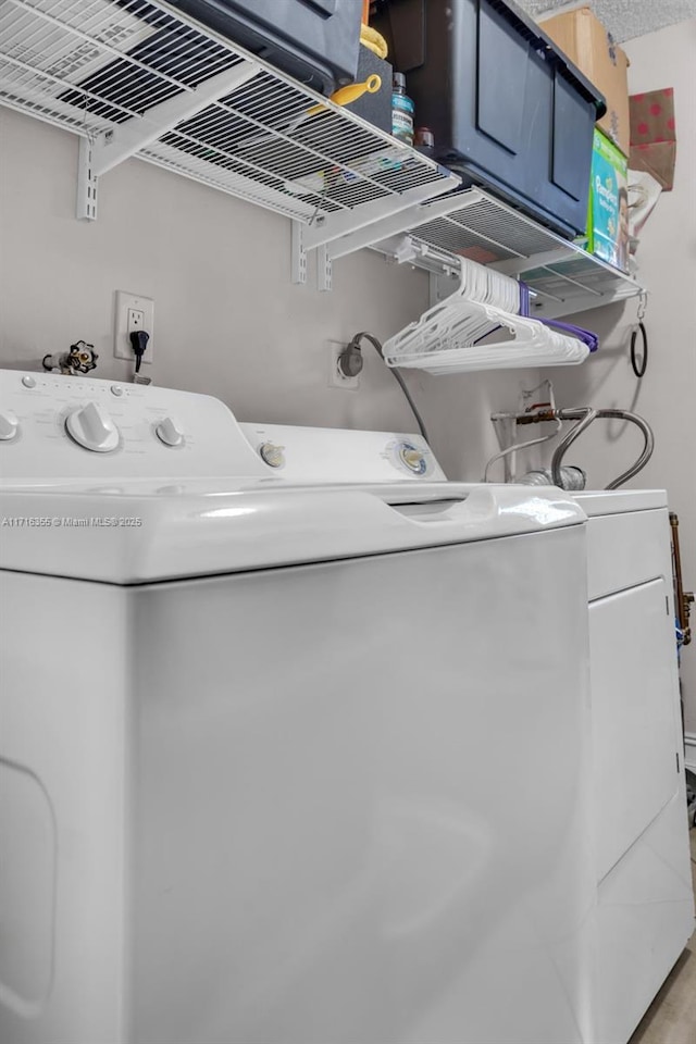 laundry room with washer and dryer and laundry area