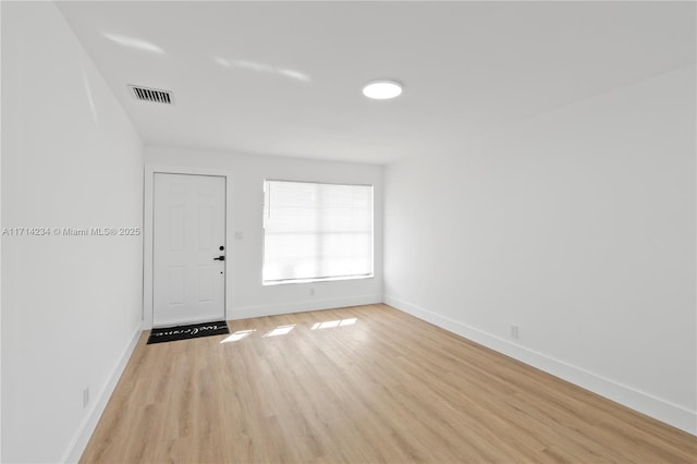 empty room featuring light hardwood / wood-style floors