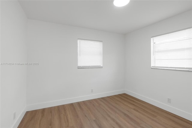 unfurnished room featuring wood-type flooring