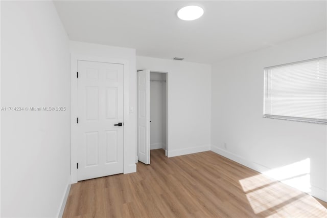 unfurnished bedroom featuring light hardwood / wood-style floors