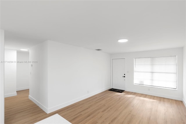 empty room with light wood-type flooring