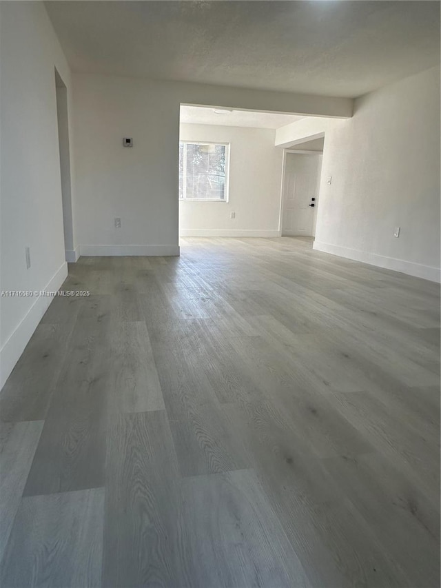 unfurnished room featuring wood-type flooring