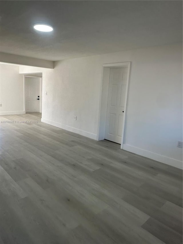 spare room with hardwood / wood-style flooring