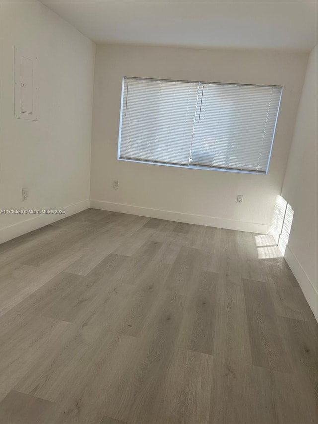 spare room featuring light hardwood / wood-style flooring