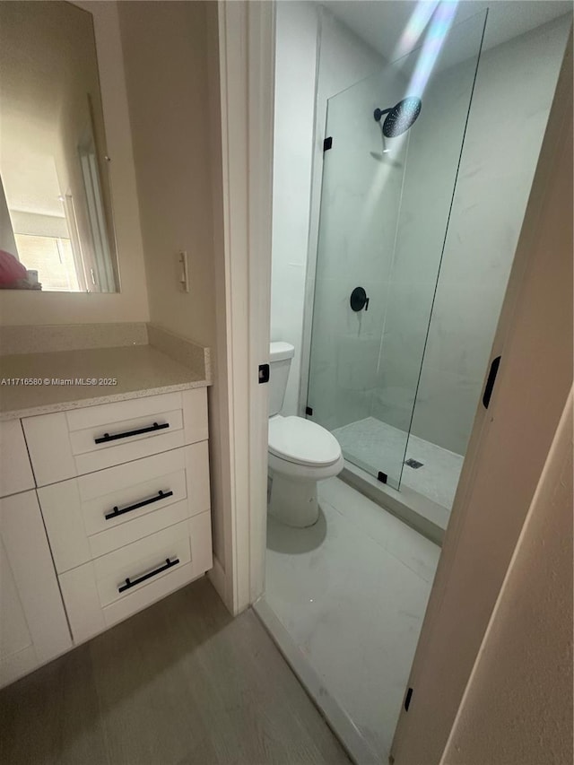 bathroom with toilet and walk in shower