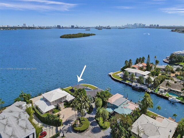 birds eye view of property featuring a water view