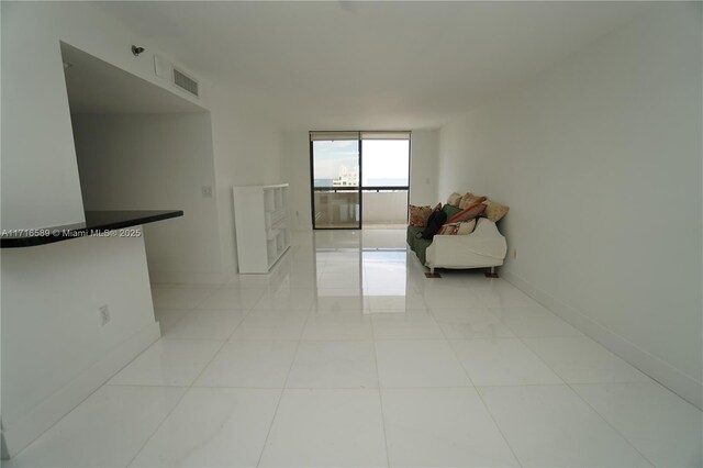 interior space featuring floor to ceiling windows